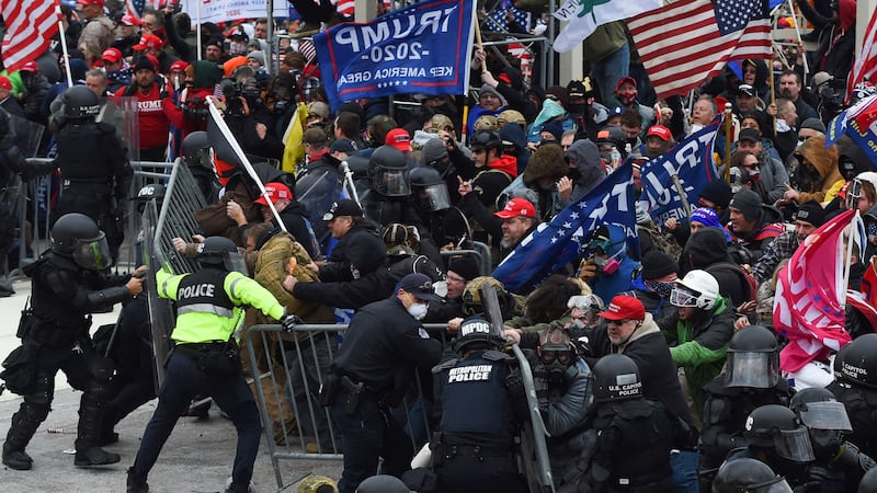 Trump supporters clash with police and security forces as they push barricades to storm the U.S. Capitol in Washington D.C on January 6, 2021.